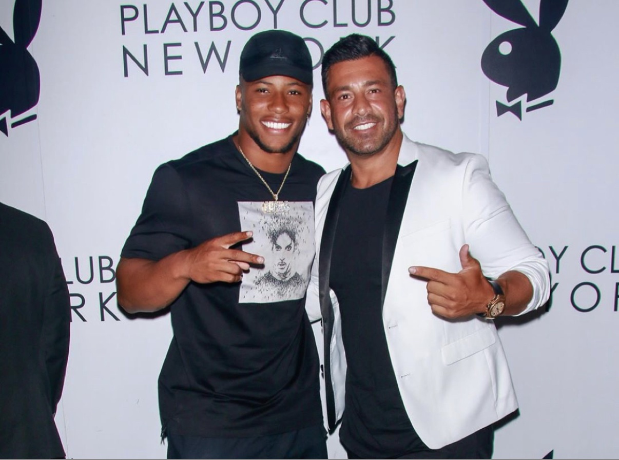 Richie Hosein with Saquon Barkley in front of the Playboy Club New York step-and-repeat